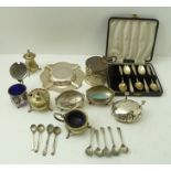 A COLLECTION OF SILVER ITEMS comprising; an ashtray, a case containing five coffee spoons, eight