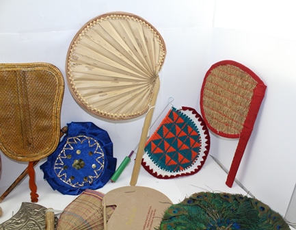 A COLLECTION OF INDIAN FANS (PANKHA) includes two peacock feather examples, an embossed white - Image 4 of 5
