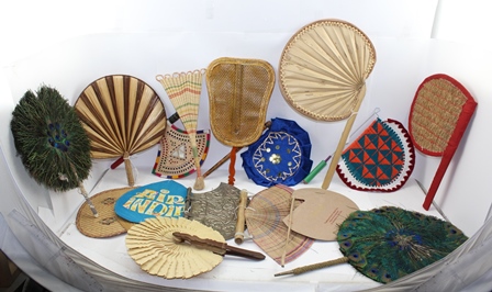 A COLLECTION OF INDIAN FANS (PANKHA) includes two peacock feather examples, an embossed white