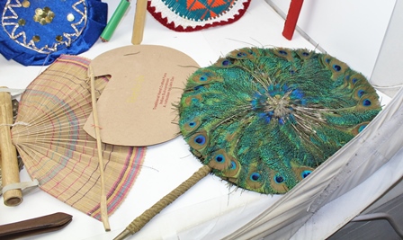 A COLLECTION OF INDIAN FANS (PANKHA) includes two peacock feather examples, an embossed white - Image 5 of 5