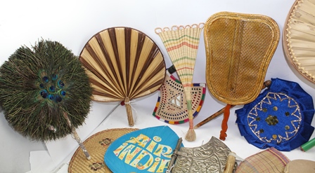 A COLLECTION OF INDIAN FANS (PANKHA) includes two peacock feather examples, an embossed white - Image 3 of 5