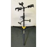 A FOLDING "HERCULES" BRANDED GUITAR STAND for 3 instruments