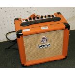 AN "ORANGE" BRANDED CRUSHED 12 MODEL HOME PRACTICE AMP, with lead