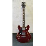 A LEFT HANDED "ARIA" CANDY APPLE RED FINISHED GIBSON DESIGN SEMI-ACOUSTIC GUITAR, with strap