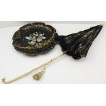 A VICTORIAN PARASOL with folding carved ivory handle, black lace over ivory silk, in storage bag,