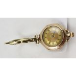 A 9CT GOLD CASED LADY'S WRIST WATCH with enamel inlay, on a plated expandable bracelet strap
