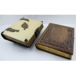 TWO VICTORIAN PHOTOGRAPH ALBUMS, one with musical movement, the other with chromolithograph