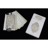 A 19TH CENTURY CHINESE CARVED IVORY VISITING CARD CASE, shallow carved panels of figures in gardens,