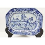A CHINESE PORCELAIN PLATE having cobalt blue painted decoration, depicting two figures in a