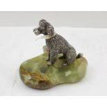 AN "ASPREY" OF LONDON CAST SILVER POODLE DOG modelled in seated position, mounted upon a polished