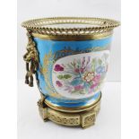 A SEVRES STYLE PORCELAIN JARDINIERE with gilt metal mounts, having lion ring mask handles, beaded