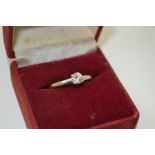 A SOLITAIRE DIAMOND RING, brilliant cut stone on an 18ct white gold band, ring size "N"