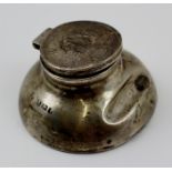 AN EDWARDIAN SILVER INKWELL with hinged cover and pen rest, fitted glass liner, Birmingham 1908,