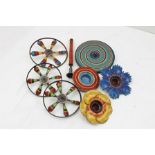 A COLLECTION OF PROBABLY GERMAN EARLY 20TH CENTURY TIN-PLATE SPINNING TOPS, two of floral design,