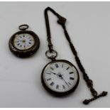 TWO LATE VICTORIAN LADY'S SILVER CASED POCKET WATCHES each with chased decoration and white enamel