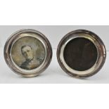 WILLIAM HUTTON AND SONS LTD. A PAIR OF CIRCULAR SILVER MOUNTED PHOTOGRAPH FRAMES with beaded
