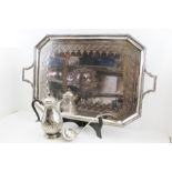 A LATE VICTORIAN LARGE SILVER-PLATED TEA TRAY of rectangular form with canted corners, with two