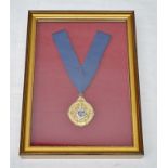 A CIVIC MEDALLION on a blue ribbon, gilt metal with enamel coat of arms, box framed. label verso "