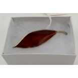 A DAVID ANDERSEN NORWEGIAN SILVER AND RED ENAMEL LEAF BROOCH, maker's mark to reverse, 7cm