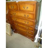 A REPRODUCTION YEW WOOD FINISHED TALL CHEST OF DRAWERS