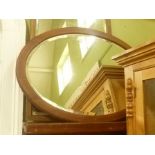 TWO BEVEL PLATE WALL MIRRORS in stained wood frames