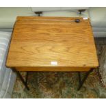 A METAL FRAMED WOODEN SCHOOL DESK of typical form and design