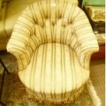 A 19TH CENTURY HORSESHOE BACKED UPHOLSTERED OCCASIONAL CHAIR with tasselled fringe
