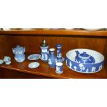 A SHELF CONTAINING A SELECTION OF DARK AND POWDER BLUE WEDGWOOD JASPERWARE