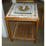 A SMALL TILE TOP TABLE depicting a cockerel