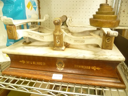 A SET OF AVERY LIMITED SCALES with weights, mounted on a wooden plinth with the legend 'Day &
