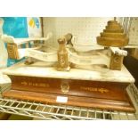 A SET OF AVERY LIMITED SCALES with weights, mounted on a wooden plinth with the legend 'Day &
