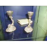 A PAIR OF CAST METAL CANDLESTICKS depicting a dolphin on a scallop shell, together with AN ART