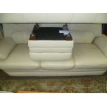 ONE BLONDE THREE SEATER LEATHER SOFA together with foot stool