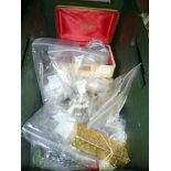 A GREEN CRATE CONTAINING A SELECTION OF BAGGED COSTUME JEWELLERY VARIOUS