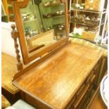 AN OAK DRESSING CHEST with large adjustable mirrored back, on barley twist support, the base unit