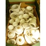 A BOX CONTAINING AN EXTENSIVE PORCELAIN ORIENTAL DESIGN TEA AND COFFEE SERVICE