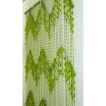 A BOTTLE GREEN 1970s PLASTIC BEAD DOOR SCREEN