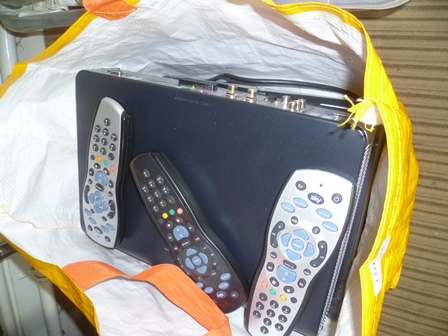 A BAG CONTAINING THREE SKY+ HD BOXES WITH REMOTE CONTROLS