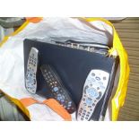 A BAG CONTAINING THREE SKY+ HD BOXES WITH REMOTE CONTROLS