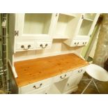 A PART PAINTED SOFTWOOD TWO PIECE KITCHEN DRESSER with twin shelved plate rack back, with glazed