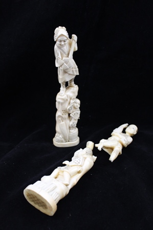 TWO JAPANESE MEIJI PERIOD IVORY CARVINGS, each depicts two people, one with a musician, the other