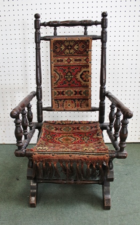 A CHILD'S AMERICAN DESIGN ROCKING CHAIR, with Turkey style upholstered seat and back