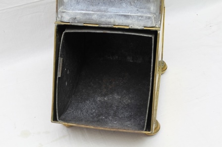 AN EDWARDIAN BRASS COAL PURDONIUM, the embossed hinged front panel reveals an interior liner, with - Image 4 of 6