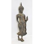A 19TH CENTURY THAI BRONZE STANDING BUDDHA, dressed in simple robes, an alms bowl in his right hand,