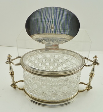 A LATE VICTORIAN BISCUIT CANISTER having silver plated mounts on an oval cut glass body - Image 4 of 4