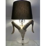 JAMIE YOUNG COMPANY (California) A RAM'S SKULL DESIGN TABLE LAMP on circular perspex base, with