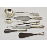 A SILVER PLATED SOUP LADLE AND VARIOUS SILVER HANDLED ITEMS includes pie slice, shoe horns, etc.