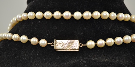 A LONG SINGLE STRAND OF CULTURED PEARLS, 0.6mm with yellow metal clasp, 128cm long - Image 2 of 2