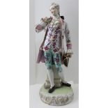 A LATE 20TH CENTURY PORCELAIN FIGURINE OF A GALLANT, a gentleman in 18th century costume, floral