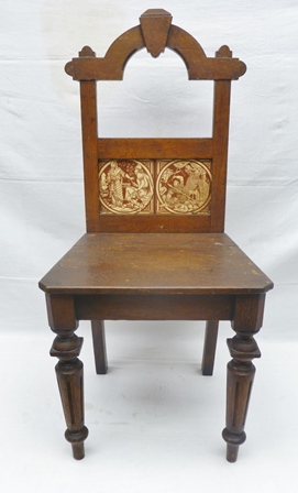 A LATE 19TH CENTURY GOTHIC REVIVAL HALL CHAIR stained and grained effect frame, the back inlaid